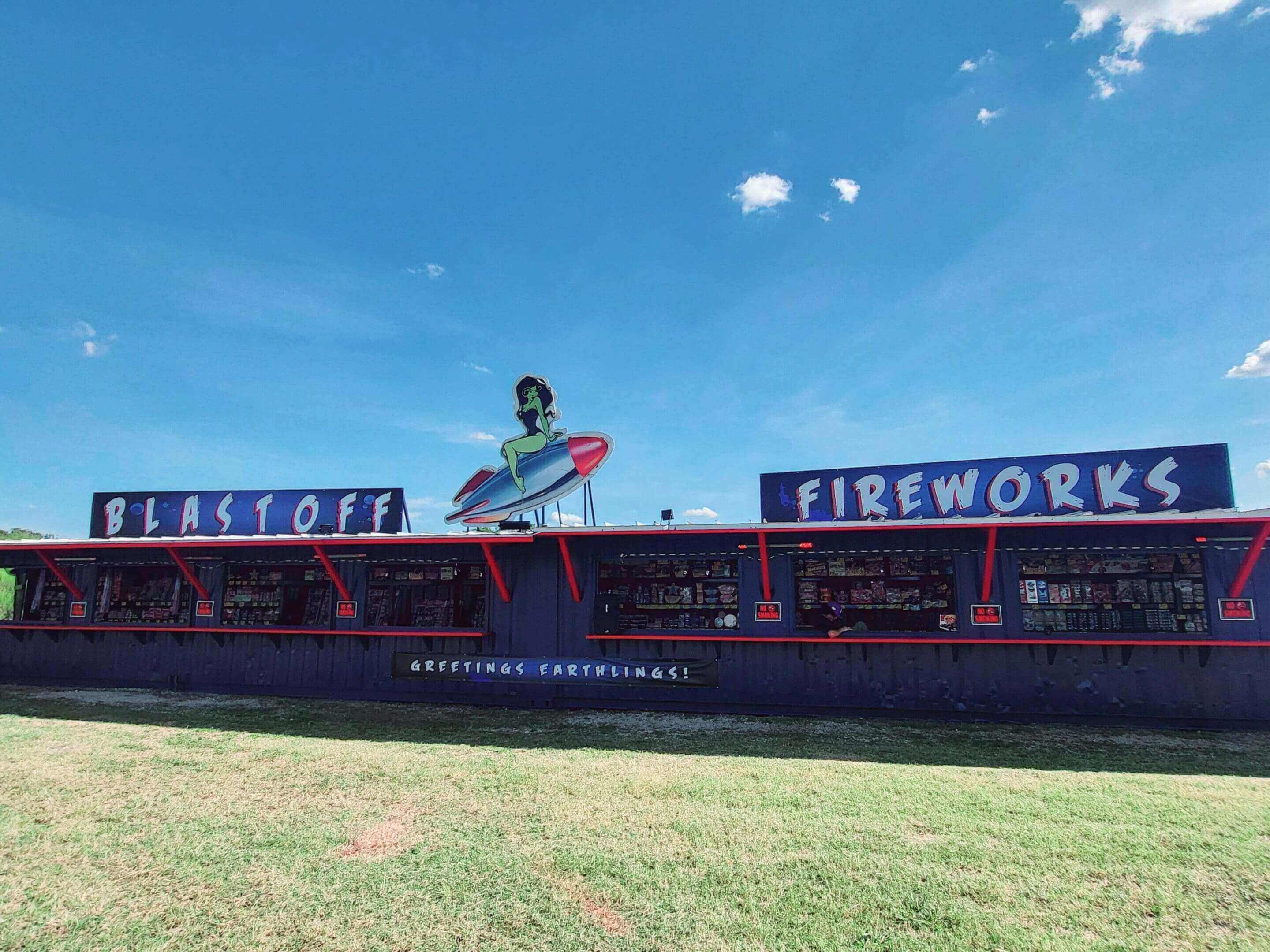 Fireworks stand with retro rocket decor.
