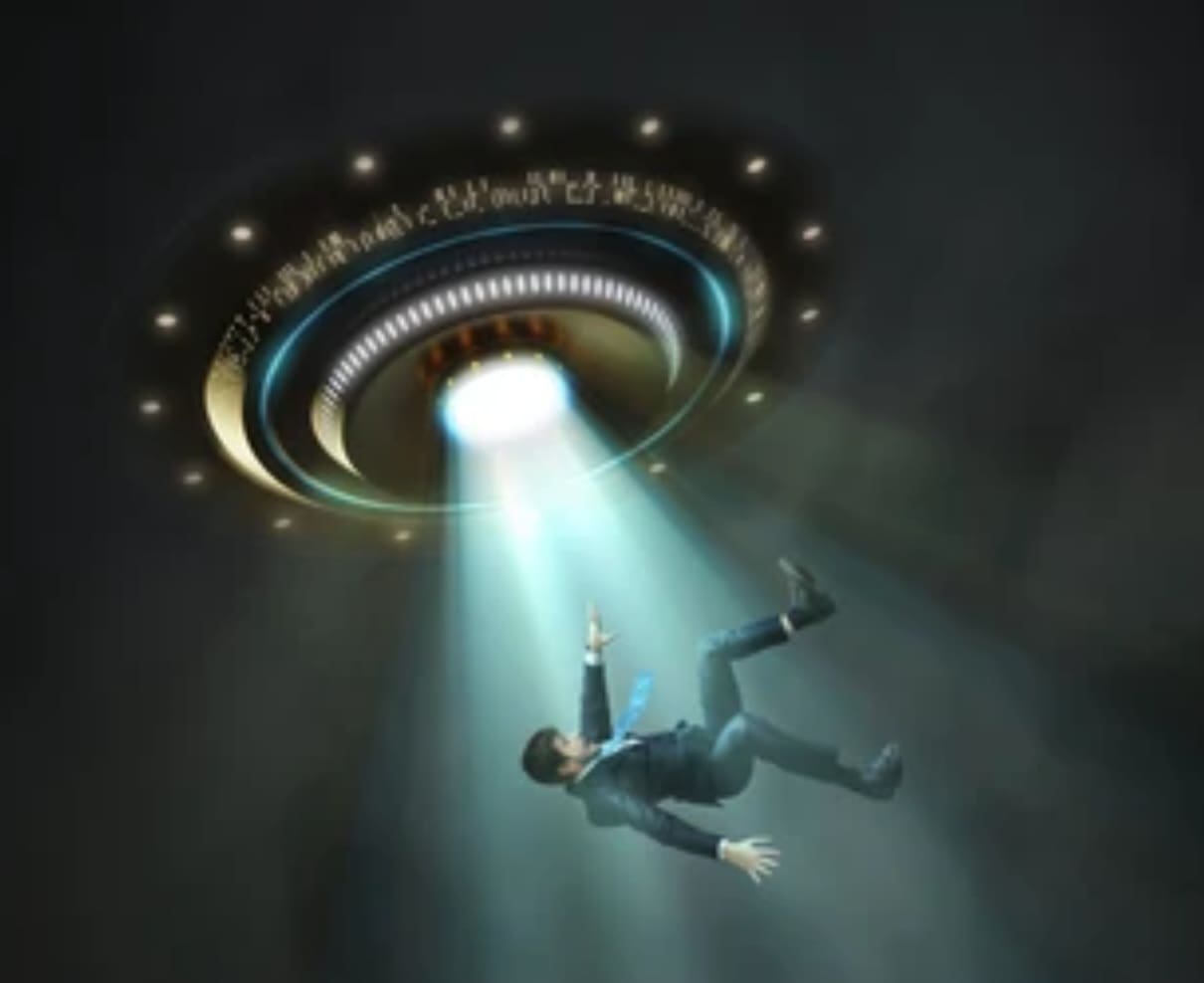 Man being abducted by a UFO.